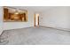 Bright living room with neutral carpeting and kitchen views at 660 S Alton Way # 5C, Denver, CO 80247
