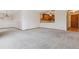 Spacious living room with neutral carpeting and access to balcony at 660 S Alton Way # 5C, Denver, CO 80247