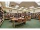 Community library with bookshelves and study tables at 660 S Alton Way # 5C, Denver, CO 80247
