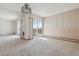 Living room with neutral carpeting and access to balcony at 660 S Alton Way # 5C, Denver, CO 80247