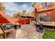 Landscaped backyard with a patio, fire pit, and basketball hoop at 345 S Ogden St, Denver, CO 80209