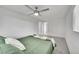 Spacious bedroom with green bedding and ceiling fan at 7131 Clay St, Westminster, CO 80030