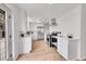 Modern white kitchen with stainless steel appliances at 7131 Clay St, Westminster, CO 80030