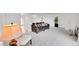 Living room featuring a gray couch and side chairs at 7131 Clay St, Westminster, CO 80030