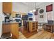 Modern kitchen with wood cabinets and island at 1555 California St # 316, Denver, CO 80202