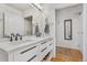 Double vanity bathroom with access to hallway at 1555 California St # 316, Denver, CO 80202
