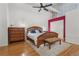 Bright bedroom, featuring hardwood floors and a ceiling fan at 1555 California St # 316, Denver, CO 80202