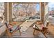 Inviting front porch with wooden chairs, offering a relaxing outdoor space at 1657 Vine St, Denver, CO 80206