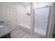 Bathroom with soaking tub, walk-in shower, and granite vanity at 7418 Blue River Ave, Frederick, CO 80530