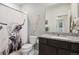 Bathroom with granite vanity, toilet and shower/tub combo at 7418 Blue River Ave, Frederick, CO 80530