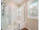 Shower with glass enclosure and built-in seat at 13159 Bellaire Ct, Thornton, CO 80241