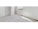 Unfurnished bedroom with gray carpet, white walls, and natural light at 3482 N Highlands Creek Pkwy, Aurora, CO 80019