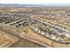 An aerial view of a residential community with houses, streets, and open spaces at 1823 Salers Way, Erie, CO 80516