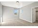 Empty bedroom with neutral walls, carpet, and window with view at 1823 Salers Way, Erie, CO 80516