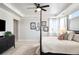 Spacious main bedroom with four-poster bed, a TV, and wall art at 1823 Salers Way, Erie, CO 80516