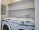 Laundry closet with Samsung washer and dryer at 14602 E 2Nd Ave # 100C, Aurora, CO 80011