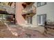 Private patio with brick wall and access to the building at 14602 E 2Nd Ave # 100C, Aurora, CO 80011
