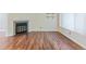 Living room features hardwood floors and a corner fireplace at 11722 E Cedar Ave, Aurora, CO 80012