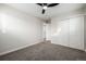 Bright bedroom with neutral walls, carpet flooring and double door closet at 5519 Troy St, Denver, CO 80239