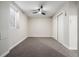 Basement bedroom with ceiling fan and window at 5519 Troy St, Denver, CO 80239