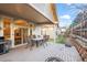 Back patio with seating, grill and fire pit at 5901 W Lehigh Ave # 9, Denver, CO 80235