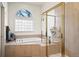 Bathroom with soaking tub and shower at 5901 W Lehigh Ave # 9, Denver, CO 80235