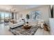 Open concept living room and dining area with modern decor at 711 N Waterloo Ct, Aurora, CO 80018