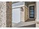 Front entrance with stone accents and a modern glass door at 711 N Waterloo Ct, Aurora, CO 80018