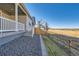 Landscaped front yard with gravel and a wooden fence at 711 N Waterloo Ct, Aurora, CO 80018
