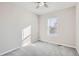 Bright bedroom with large window and ceiling fan at 711 N Waterloo Ct, Aurora, CO 80018