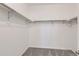 Large walk-in closet with double hanging rods and shelves at 711 N Waterloo Ct, Aurora, CO 80018