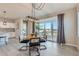 Kitchen with white cabinets, granite countertops, and a view to the dining area at 711 N Waterloo Ct, Aurora, CO 80018