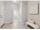 Light and airy hallway with access to laundry and other rooms at 711 N Waterloo Ct, Aurora, CO 80018