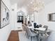 Bright dining room with hardwood floors and views of backyard at 385 Baxter Farm Ln, Erie, CO 80516