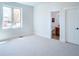 Spacious bedroom with ensuite bathroom and a large window at 385 Baxter Farm Ln, Erie, CO 80516