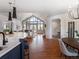 Open concept kitchen with island and breakfast bar, overlooking living room at 385 Baxter Farm Ln, Erie, CO 80516