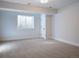 Spacious finished basement bedroom with large window and carpet at 385 Baxter Farm Ln, Erie, CO 80516