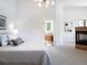 Main bedroom with ensuite bathroom and a cozy fireplace at 385 Baxter Farm Ln, Erie, CO 80516