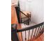 Spiral staircase with black railing and carpeted steps at 385 Baxter Farm Ln, Erie, CO 80516