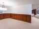 Basement dining area with wood wall paneling at 385 Baxter Farm Ln, Erie, CO 80516