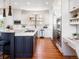 Modern kitchen with white cabinets, stainless steel appliances, and a large island at 385 Baxter Farm Ln, Erie, CO 80516