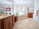 Elegant bathroom with soaking tub, double vanity, and large windows at 385 Baxter Farm Ln, Erie, CO 80516