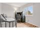 Small bedroom with a daybed, workspace, and plenty of natural light at 2103 Coronado N. Pkwy # D, Denver, CO 80229