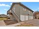 Exterior view of the building, showing stairs and garages at 2103 Coronado N. Pkwy # D, Denver, CO 80229