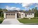 One-story home with light brown siding, stone accents, and a two-car garage at 24720 E 36Th Ave, Aurora, CO 80019