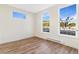 Well-lit bedroom with wood-look flooring and large windows at 5870 W 91St Ave, Westminster, CO 80031