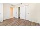 Bright bedroom featuring wood-look flooring and a large closet at 5870 W 91St Ave, Westminster, CO 80031