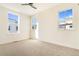 Bright bedroom with large windows and plush carpeting at 5870 W 91St Ave, Westminster, CO 80031