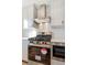 Stainless steel appliances and white penny tile backsplash in modern kitchen at 5870 W 91St Ave, Westminster, CO 80031