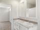Bathroom with double vanity, marble countertop, and separate shower at 165 S County Road 197, Byers, CO 80103